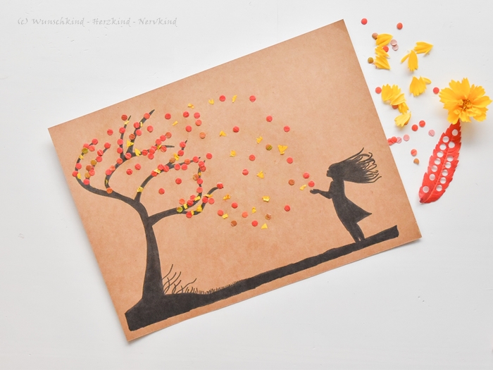 Herbstwind mit ausgestanztem Herbstlaub